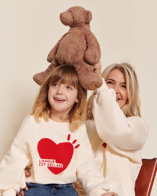 Le sweat l'amour est déclaré enfant en coton bio - crème