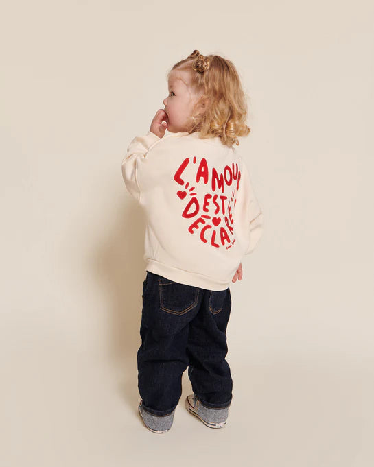 Le sweat Sam L'amour est déclaré en coton bio - crème / rouge